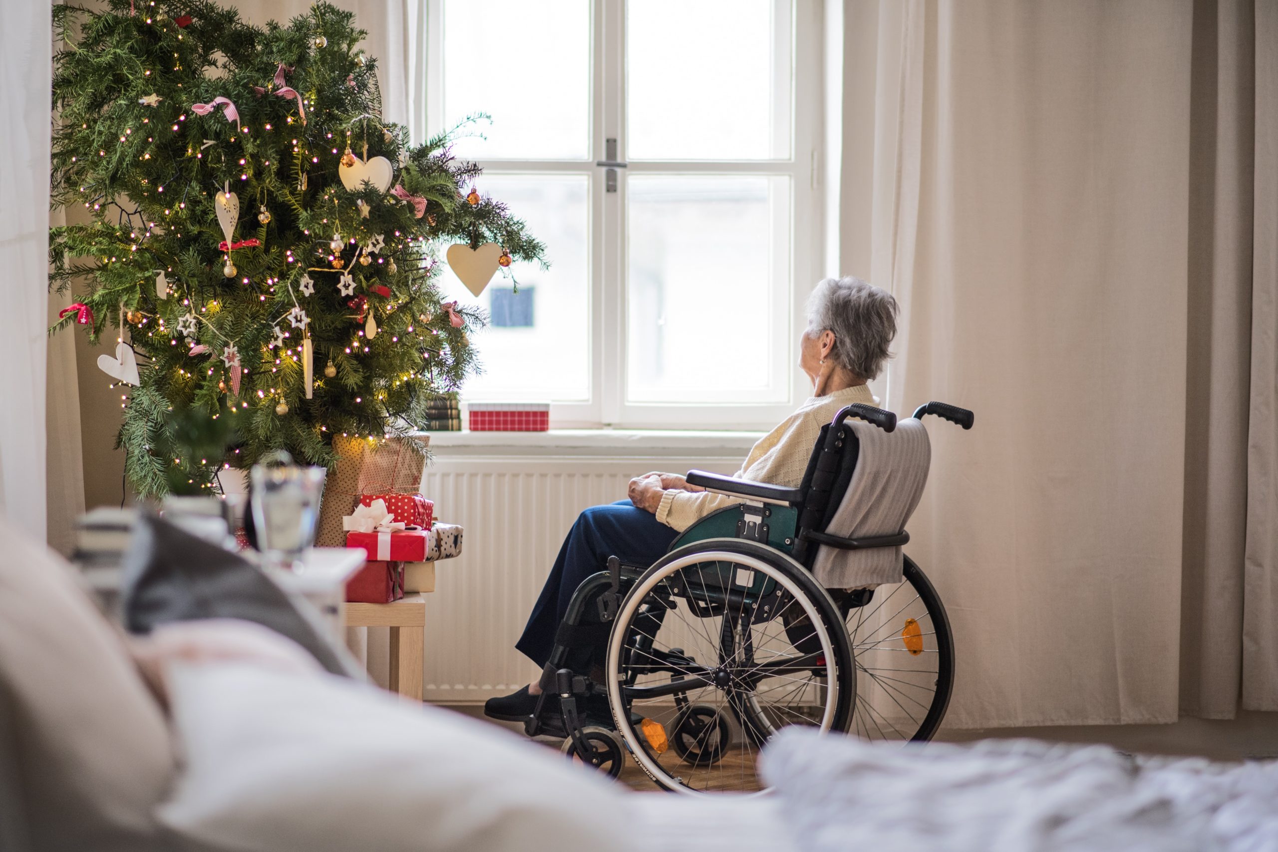 home care, sensenior woman looking outside the windowior, alone, holidays