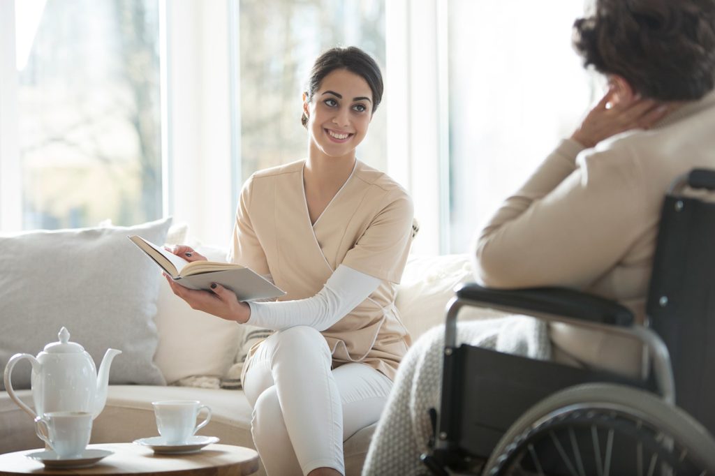 caregiver-reading-book-54JSU38