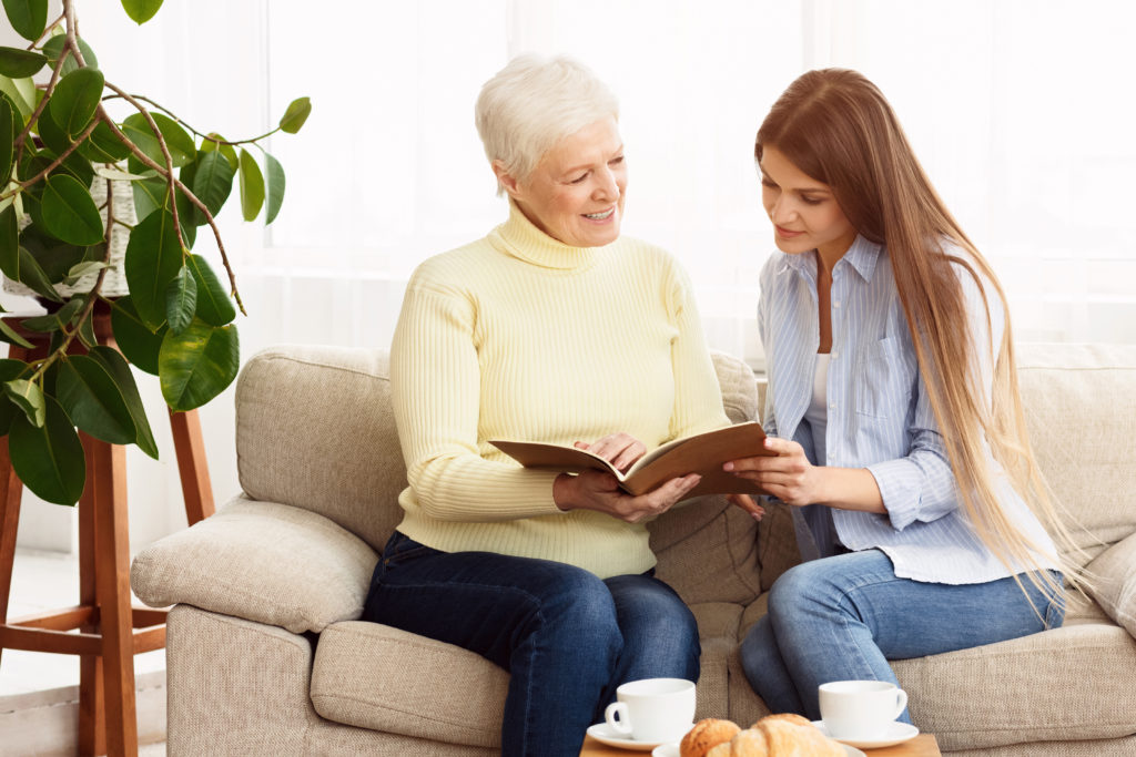 senior woman checking notes with a love one