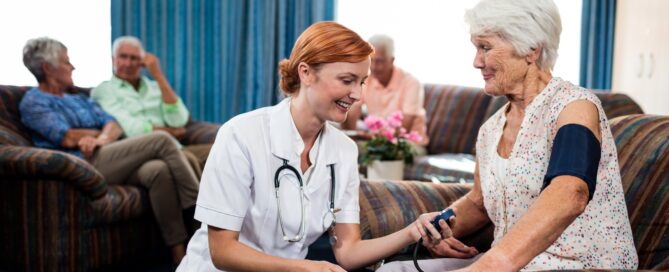 Nurse taking care of pensioner in the retirement house