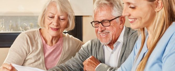 A daughter sits down to help her senior parents with their finances.