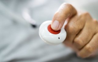 Technologies like this medical alert button can help with senior care and safety.