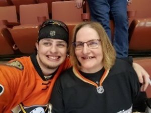 Susan and her son Randy at a Ducks game