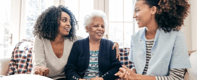 A professional explains senior care options to a woman and her aging mom.
