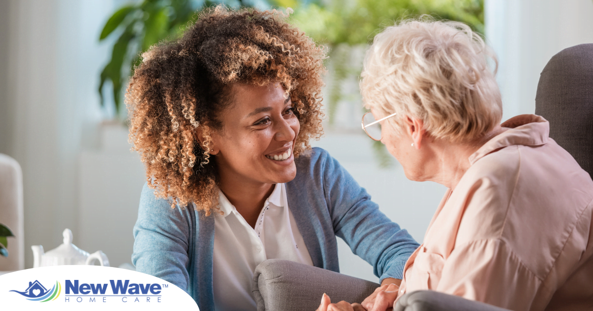 A woman enjoys compassionately providing caregiving services to an elderly woman.