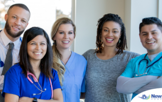 A team of healthcare professionals smiles, representing the many career paths that professional caregiving can lead to.