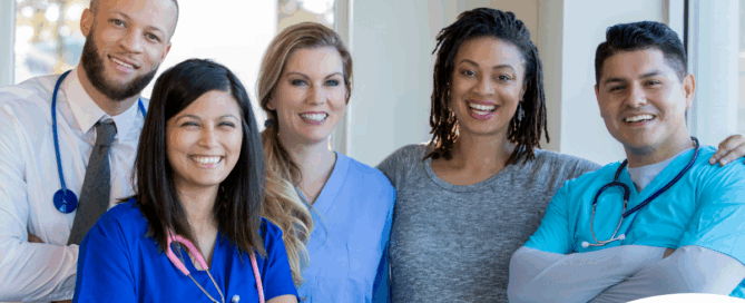 A team of healthcare professionals smiles, representing the many career paths that professional caregiving can lead to.