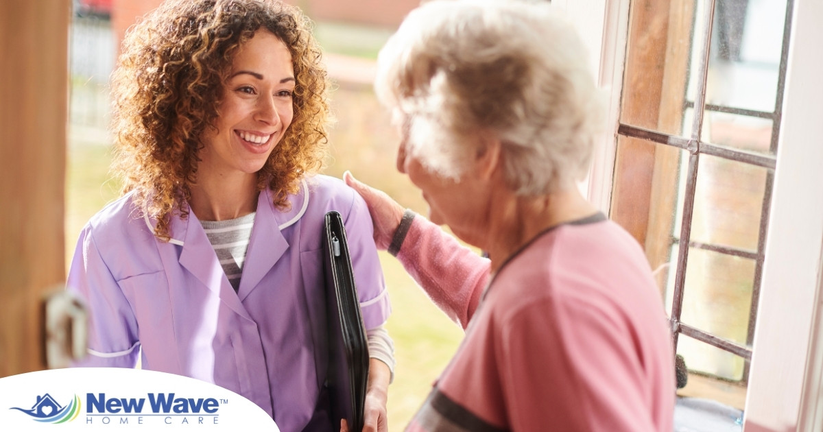 A happy caregiver enters the home of a client, representing in-home recovery care.