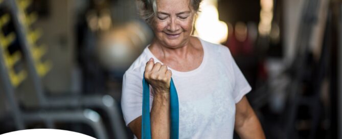 An older woman uses a resistance band to exercise, representing how staying active can help older adults keep their blood pressure in a healthy range.