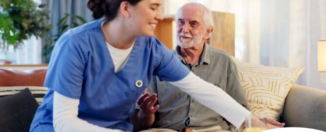 Caregiver providing senior care at home to manage parkinson’s and related symptoms.