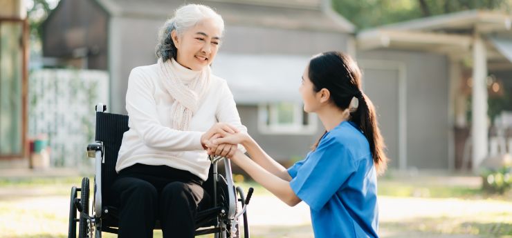 Compassionate Personal Care Support for Seniors in South Bay Caregiver assisting a senior woman in a wheelchair during personal care support in South Bay
