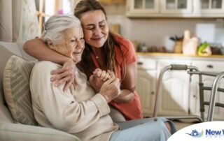 Caregiver supporting an elderly woman in the transition to senior home care