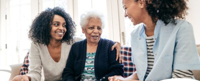 Caregiver talking to a family about Elderly Care