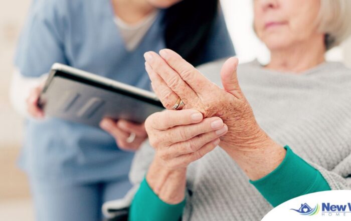 A caregiver provides in home care services to a senior with arthritis