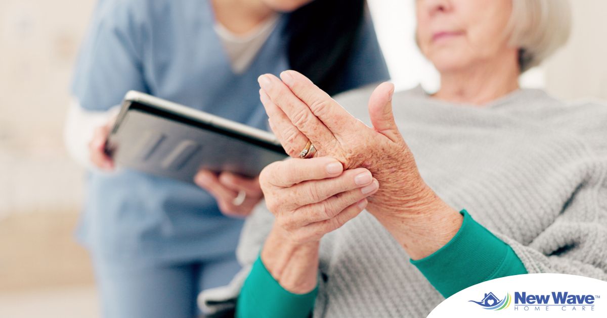 A caregiver provides in home care services to a senior with arthritis