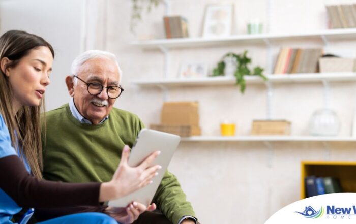 Home caregiver assisting senior man to use telehealth and senior care