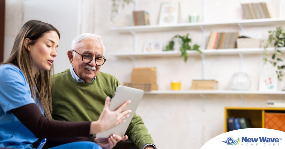 Home caregiver assisting senior man to use telehealth and senior care