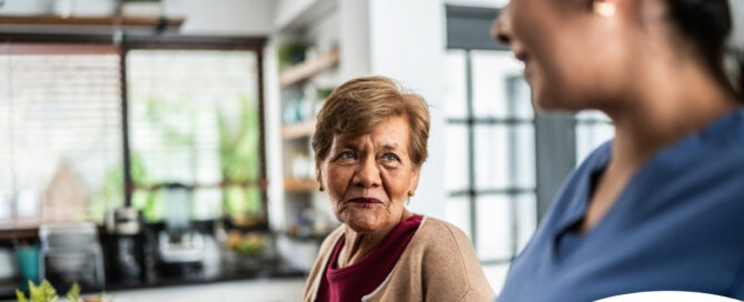 Caregiver provides attentive senior care as part of diabetes awareness